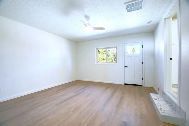 445 Rim Rd, Los Alamos, NM 87544 - entryway with wood finished floors, ceiling fan, a textured ceiling, and baseboards