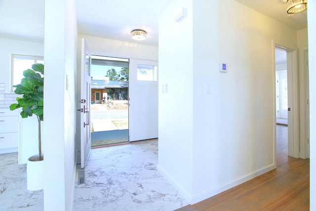 445 Rim Rd, Los Alamos, NM 87544 - hall featuring marble finish floors and baseboards