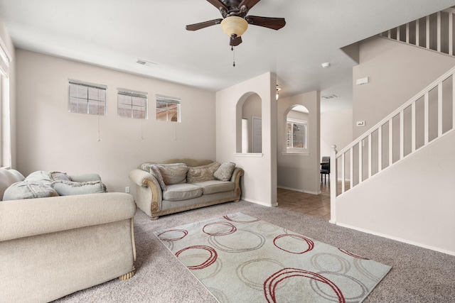 5236 Na Pali St NE, Albuquerque, NM 87111 - carpeted living room with ceiling fan, stairs, and baseboards