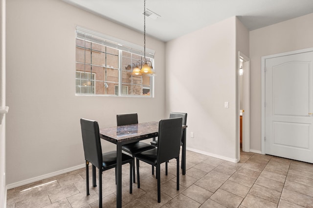 5236 Na Pali St NE, Albuquerque, NM 87111 - dining area featuring baseboards and a chandelier