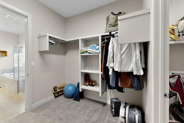 3406 Falkirk Rd NE, Rio Rancho, NM 87144 - spacious closet with tile patterned flooring and carpet floors
