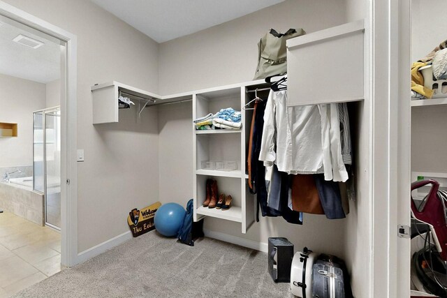 3406 Falkirk Rd NE, Rio Rancho, NM 87144 - spacious closet with tile patterned flooring and carpet floors