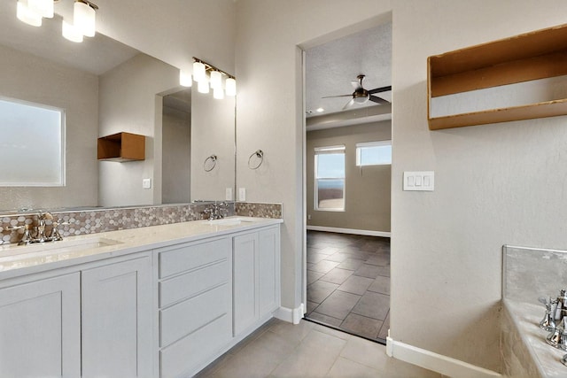 3406 Falkirk Rd NE, Rio Rancho, NM 87144 - full bath with tile patterned floors, double vanity, and a ceiling fan