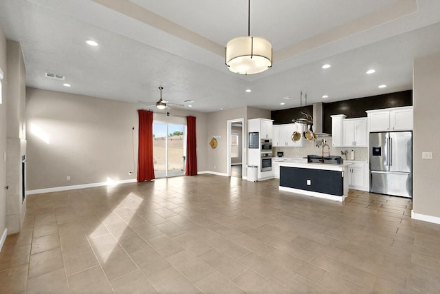 3406 Falkirk Rd NE, Rio Rancho, NM 87144 - unfurnished living room featuring recessed lighting, baseboards, a ceiling fan, light tile patterned floors, and a tray ceiling