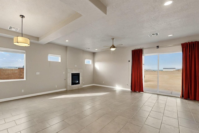 3406 Falkirk Rd NE, Rio Rancho, NM 87144 - unfurnished living room with ceiling fan, recessed lighting, a textured ceiling, baseboards, and a tiled fireplace