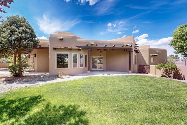 4700 Quaker Heights Pl NW, Albuquerque, NM 87120 - back of house featuring a patio and stucco siding