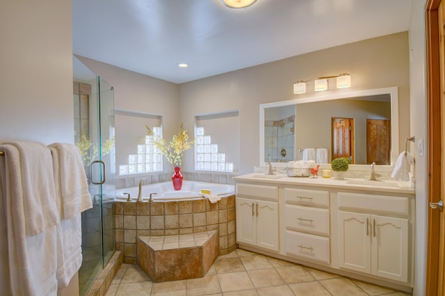 4700 Quaker Heights Pl NW, Albuquerque, NM 87120 - bathroom featuring tile patterned floors, a stall shower, a bath, and double vanity