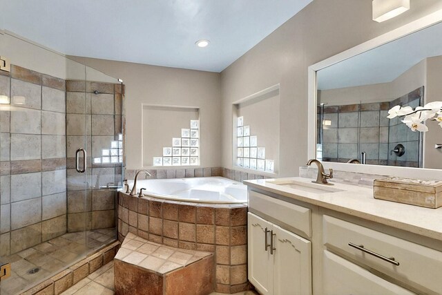4700 Quaker Heights Pl NW, Albuquerque, NM 87120 - bathroom featuring a shower stall, a bath, vanity, and tile patterned flooring
