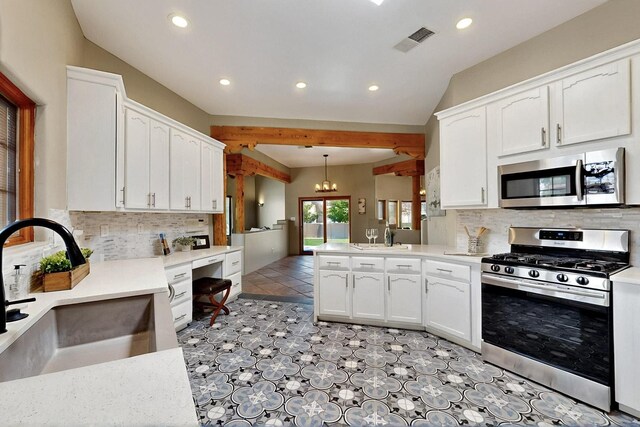 4700 Quaker Heights Pl NW, Albuquerque, NM 87120 - kitchen featuring stainless steel appliances, a sink, recessed lighting, white cabinets, and vaulted ceiling