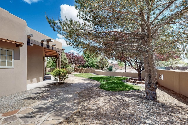 4700 Quaker Heights Pl NW, Albuquerque, NM 87120 - view of yard featuring fence and a patio area