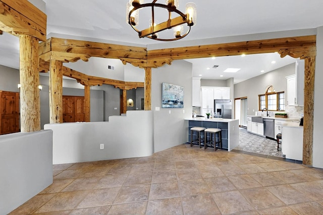 4700 Quaker Heights Pl NW, Albuquerque, NM 87120 - kitchen featuring stainless steel appliances, a chandelier, light countertops, white cabinetry, and recessed lighting