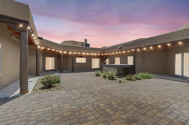 4700 Quaker Heights Pl NW, Albuquerque, NM 87120 - patio terrace at dusk featuring a hot tub