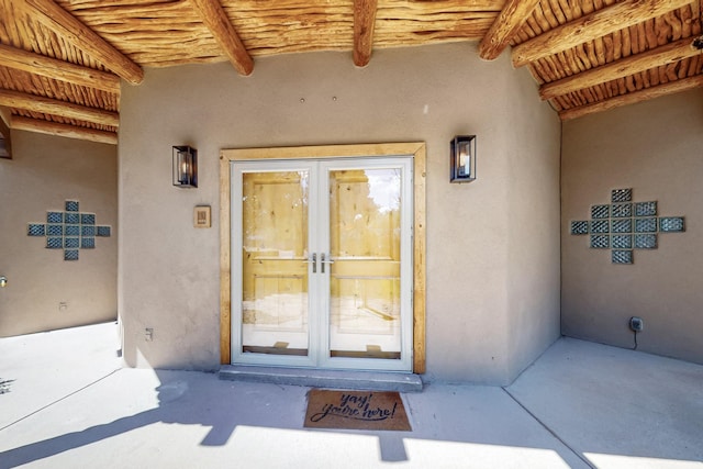 4700 Quaker Heights Pl NW, Albuquerque, NM 87120 - doorway to property with french doors and stucco siding