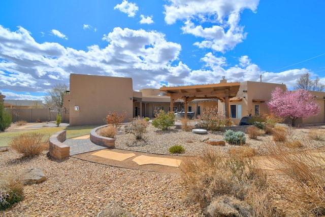 4700 Quaker Heights Pl NW, Albuquerque, NM 87120 - rear view of house featuring stucco siding