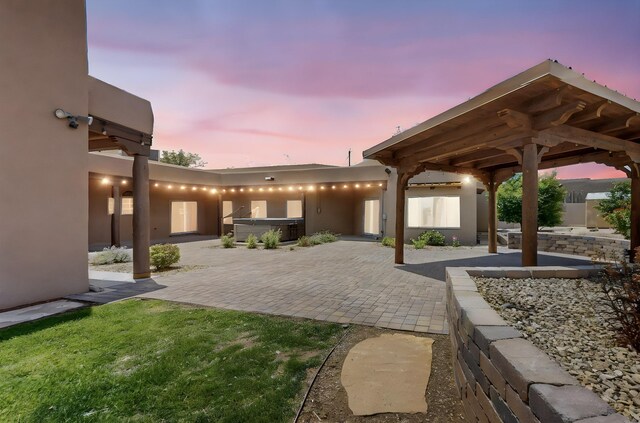 4700 Quaker Heights Pl NW, Albuquerque, NM 87120 - patio terrace at dusk with a hot tub