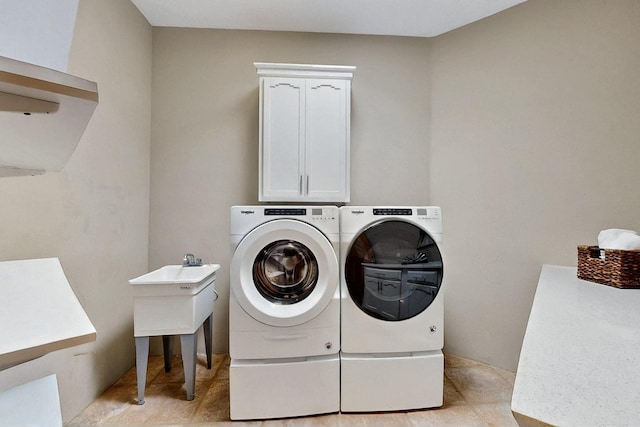 4700 Quaker Heights Pl NW, Albuquerque, NM 87120 - laundry area featuring washing machine and clothes dryer and cabinet space