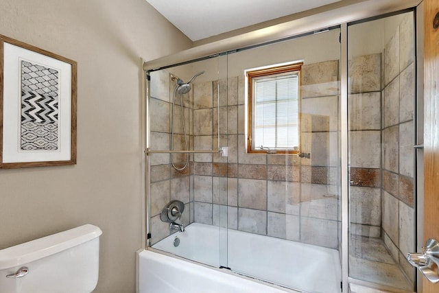 4700 Quaker Heights Pl NW, Albuquerque, NM 87120 - bathroom featuring toilet and bath / shower combo with glass door