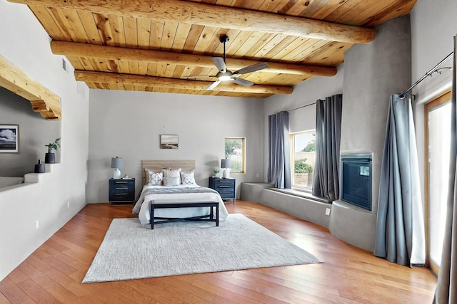 4700 Quaker Heights Pl NW, Albuquerque, NM 87120 - bedroom with wooden ceiling, light wood-type flooring, beamed ceiling, and ceiling fan