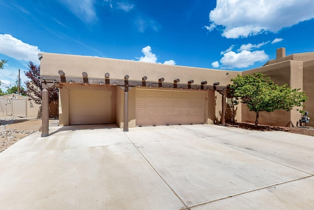 4700 Quaker Heights Pl NW, Albuquerque, NM 87120 - garage featuring concrete driveway