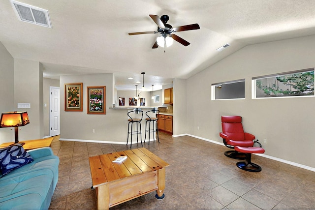 10912 Saltillo St NW, Albuquerque, NM 87114 - living room featuring a ceiling fan, baseboards, tile patterned flooring, and lofted ceiling