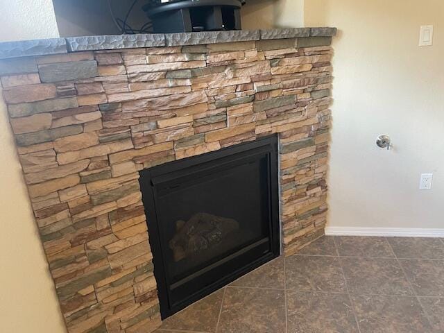 10912 Saltillo St NW, Albuquerque, NM 87114 - detailed view of baseboards and a stone fireplace