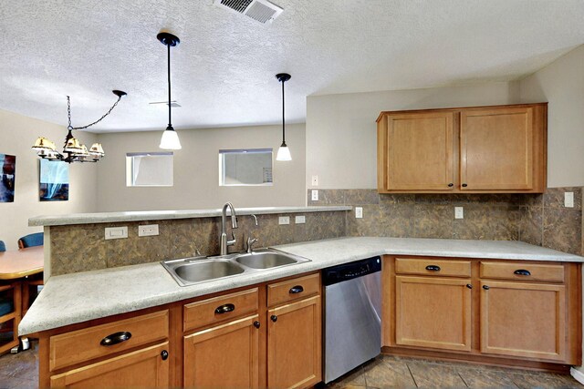 10912 Saltillo St NW, Albuquerque, NM 87114 - kitchen with stainless steel dishwasher, a sink, a peninsula, hanging light fixtures, and a textured ceiling