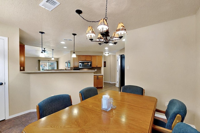 10912 Saltillo St NW, Albuquerque, NM 87114 - dining area with baseboards, a chandelier, a textured ceiling, and recessed lighting