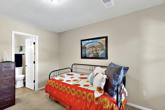 10912 Saltillo St NW, Albuquerque, NM 87114 - carpeted bedroom with baseboards, connected bathroom, and a textured ceiling