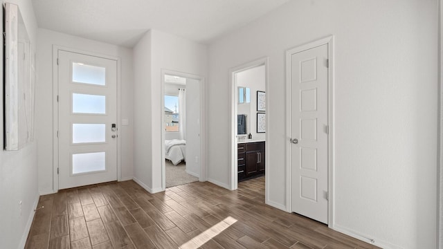 4114 Silver Springs Rd NE, Rio Rancho, NM 87144 - entryway featuring baseboards and dark wood-style floors
