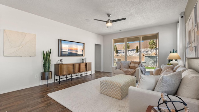 4114 Silver Springs Rd NE, Rio Rancho, NM 87144 - living room with dark wood finished floors, a ceiling fan, baseboards, and a textured ceiling