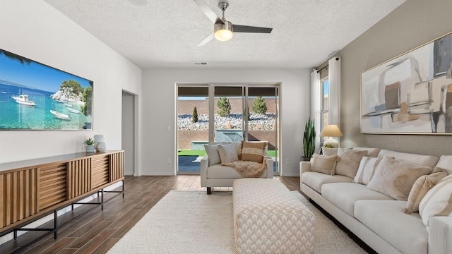 4114 Silver Springs Rd NE, Rio Rancho, NM 87144 - living room featuring wood finish floors, ceiling fan, a textured ceiling, and baseboards