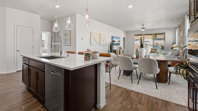 4114 Silver Springs Rd NE, Rio Rancho, NM 87144 - kitchen with dishwasher, dark wood finished floors, a sink, open floor plan, and ceiling fan