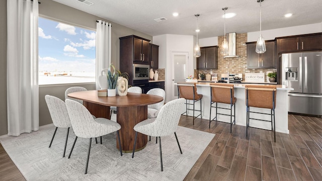 4114 Silver Springs Rd NE, Rio Rancho, NM 87144 - dining area with dark wood-type flooring, recessed lighting, and baseboards