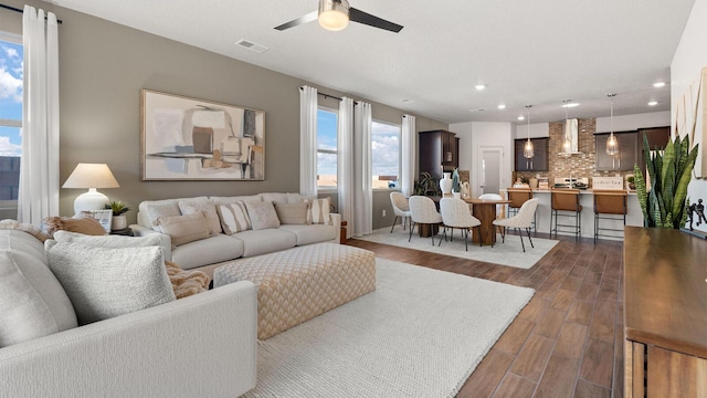 4114 Silver Springs Rd NE, Rio Rancho, NM 87144 - living room featuring dark wood finished floors, ceiling fan, and recessed lighting