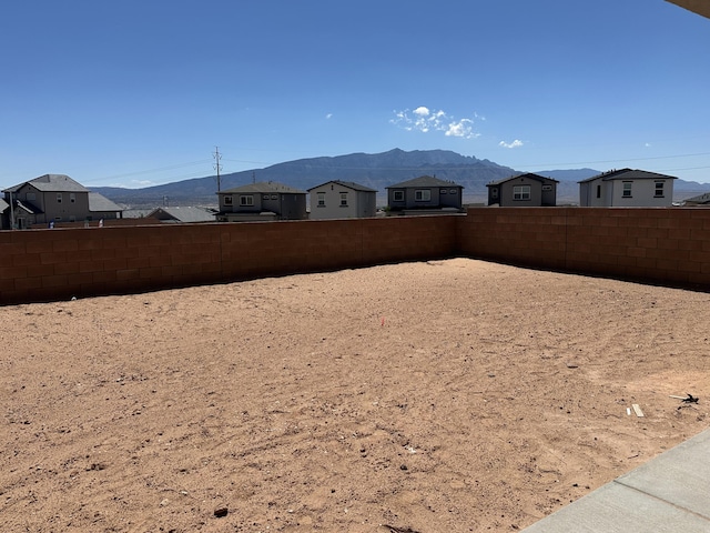 4114 Silver Springs Rd NE, Rio Rancho, NM 87144 - fenced backyard featuring a mountain view
