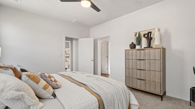 4114 Silver Springs Rd NE, Rio Rancho, NM 87144 - bedroom featuring light colored carpet, ceiling fan, and a textured ceiling