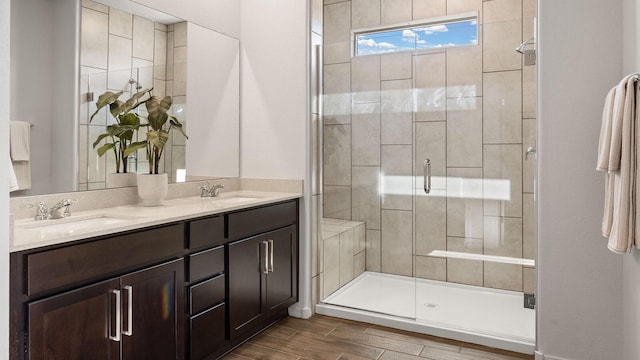 4114 Silver Springs Rd NE, Rio Rancho, NM 87144 - full bathroom with a shower stall, double vanity, and wood finish floors