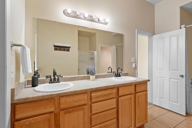bathroom featuring an enclosed shower, tile patterned flooring, and double vanity