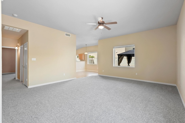 unfurnished room with a ceiling fan, carpet flooring, and baseboards