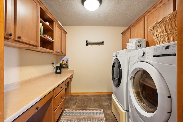 6119 La Paz Rd NE, Rio Rancho, NM 87144 - washroom featuring cabinet space, independent washer and dryer, a textured ceiling, baseboards, and dark tile patterned flooring