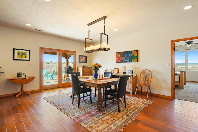 6119 La Paz Rd NE, Rio Rancho, NM 87144 - dining space featuring wood-type flooring, baseboards, recessed lighting, a textured ceiling, and a chandelier