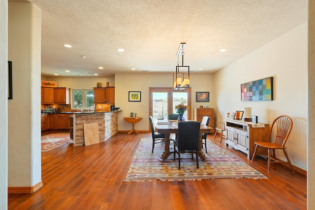 6119 La Paz Rd NE, Rio Rancho, NM 87144 - dining area with baseboards, dark wood-type flooring, and recessed lighting