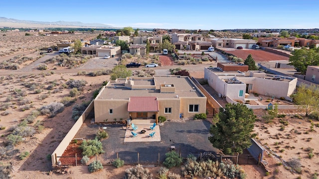 6119 La Paz Rd NE, Rio Rancho, NM 87144 - aerial perspective of suburban area featuring a mountainous background