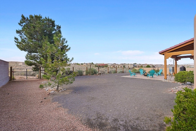 6119 La Paz Rd NE, Rio Rancho, NM 87144 - view of yard featuring a patio area and a gate