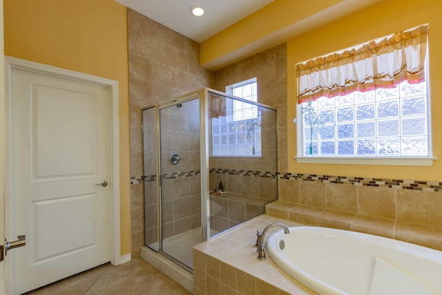 301 Zuni River Cir SW, Los Lunas, NM 87031 - full bath featuring a shower stall, a garden tub, tile patterned flooring, and recessed lighting