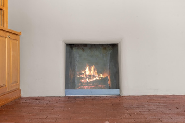 384 Chaparral Ln, Corrales, NM 87048 - detailed view of a lit fireplace