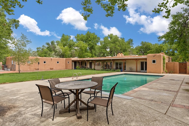 384 Chaparral Ln, Corrales, NM 87048 - swimming pool featuring a patio and a yard