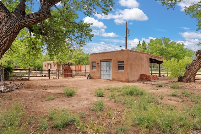 384 Chaparral Ln, Corrales, NM 87048 - view of outdoor structure featuring an outbuilding and fence