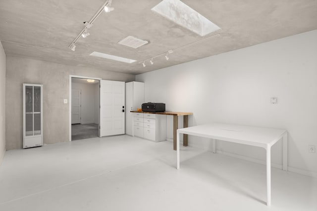384 Chaparral Ln, Corrales, NM 87048 - office featuring a skylight, concrete floors, and a heating unit