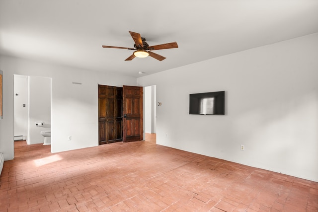 384 Chaparral Ln, Corrales, NM 87048 - empty room with a ceiling fan, baseboard heating, and brick patterned flooring